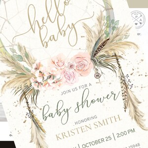 May include: A boho-style baby shower invitation with a dreamcatcher design. The invitation features a watercolor illustration of a dreamcatcher with feathers, pampas grass, and flowers in shades of pink and green. The text "hello baby" is written in gold script at the top of the invitation. The text "Join us for a baby shower" is written in green script below the dreamcatcher. The text "Honoring Kristen Smith" is written in gold script below the text "baby shower". The date and time of the shower are written in black script below the name.