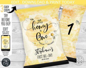 May include: A yellow and white chip bag with a honeycomb pattern. The bag has a bee and flower design with the text "Our Little Honey Is One" and "Stephanie's First Bee-Day 08 09 2020".