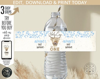 May include: A printable water bottle label with a blue and white design featuring a highland cow with the text "Holy Cow! I'm One" and "Anthony's First Birthday".