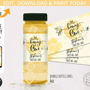 May include: A printable honeybee-themed label for a 40 oz bubble bottle. The label features a watercolor illustration of a honeycomb with the text "Our Little Honey is One" and a space to personalize with a name and "First Bee-Day".