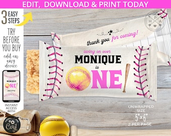 May include: A printable party favor wrapper featuring a softball design with pink stitching, a yellow softball with pink accents, and a pink and white baseball bat. The wrapper says "Swing on over Monique is One!" and "Thank you for coming!" in black text. The wrapper is 5 inches by 6 inches and prints 2 per page.