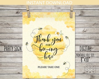 May include: A yellow and white printable party sign with a beehive and bees. The sign says "Thank you for bee-ing here" and "Please take one". The sign is 8 inches by 10 inches.