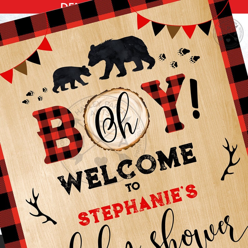 May include: A rustic wooden sign with red and black buffalo plaid trim. The sign says "Oh Boy! Welcome to Stephanie's Baby Shower". There are two black bear silhouettes and a woodgrain circle with the word "Oh" in cursive.