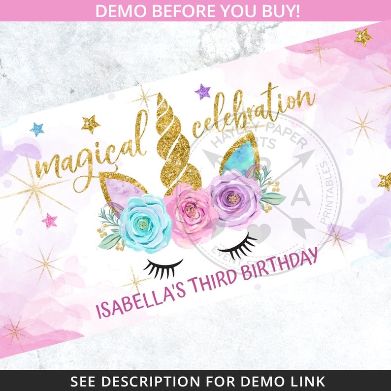 May include: A printable party banner with a unicorn illustration. The unicorn has a gold horn, blue and pink flowers, and closed eyes. The banner says "magical celebration" and "Isabella's Third Birthday".