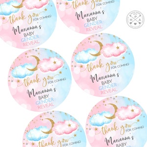 May include: Four round pink and blue gender reveal party favor stickers with gold glitter stars and a crescent moon. The stickers say "Thank you for coming! Marianna's Baby Gender Reveal".