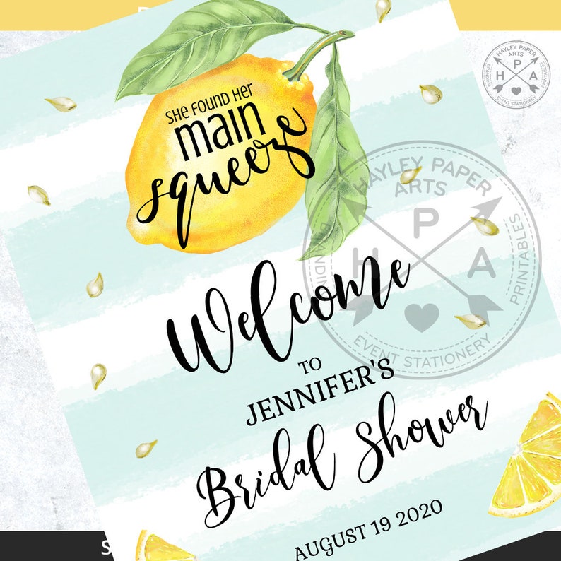 May include: A welcome sign for a bridal shower with a lemon illustration and the text "She found her main squeeze". The sign is on a blue and white striped background with the text "Welcome to Jennifer's Bridal Shower August 19, 2020".