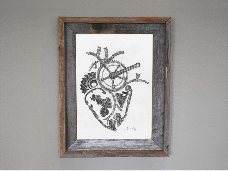 May include: A black and white drawing of a heart made of bicycle parts, including a chain, gears, and a crankset. The drawing is framed in a rustic wooden frame.