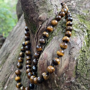 Tigers Eye semiprecious crystal healing knotted necklace