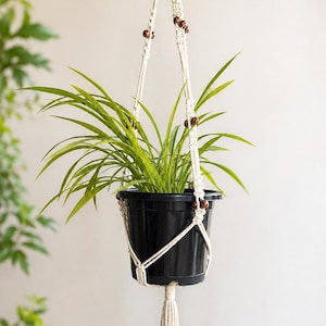 Handgemaakte plantenhanger van jute macramé | Boho decoratie voor binnentuin