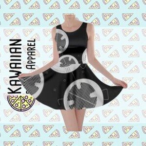 May include: Black sleeveless skater dress with a white repeating pattern of a circle with a star inside. The dress has a fitted bodice and a flared skirt.