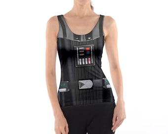 May include: Black tank top with a print of Darth Vader's chest armour from Star Wars. The design includes a belt, control panel, and accents in grey, red, and green. The tank top has a scoop neck and a racerback style.