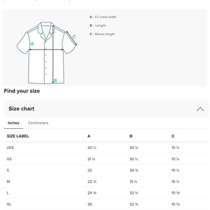 May include: A size guide with product measurements for clothing. The guide includes a diagram of a shirt with labeled measurements for chest width, length, and sleeve length. A size chart in inches is also provided.