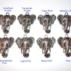 May include: Silver-toned elephant charms with various colored gemstone accents. The charms are labeled with the following colors: Amethyst Purple, Tanzanite Purple, Capri Blue, Metallic Gold, Padparadscha Pink, Light Pink, Rose Pink, and Red.