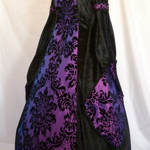 It will be made with beautiful jet black crushed velvet and purple and black flock taffeta. It will have a corset style front and back lacing so you can adjusted the dress to fit your body shape.
