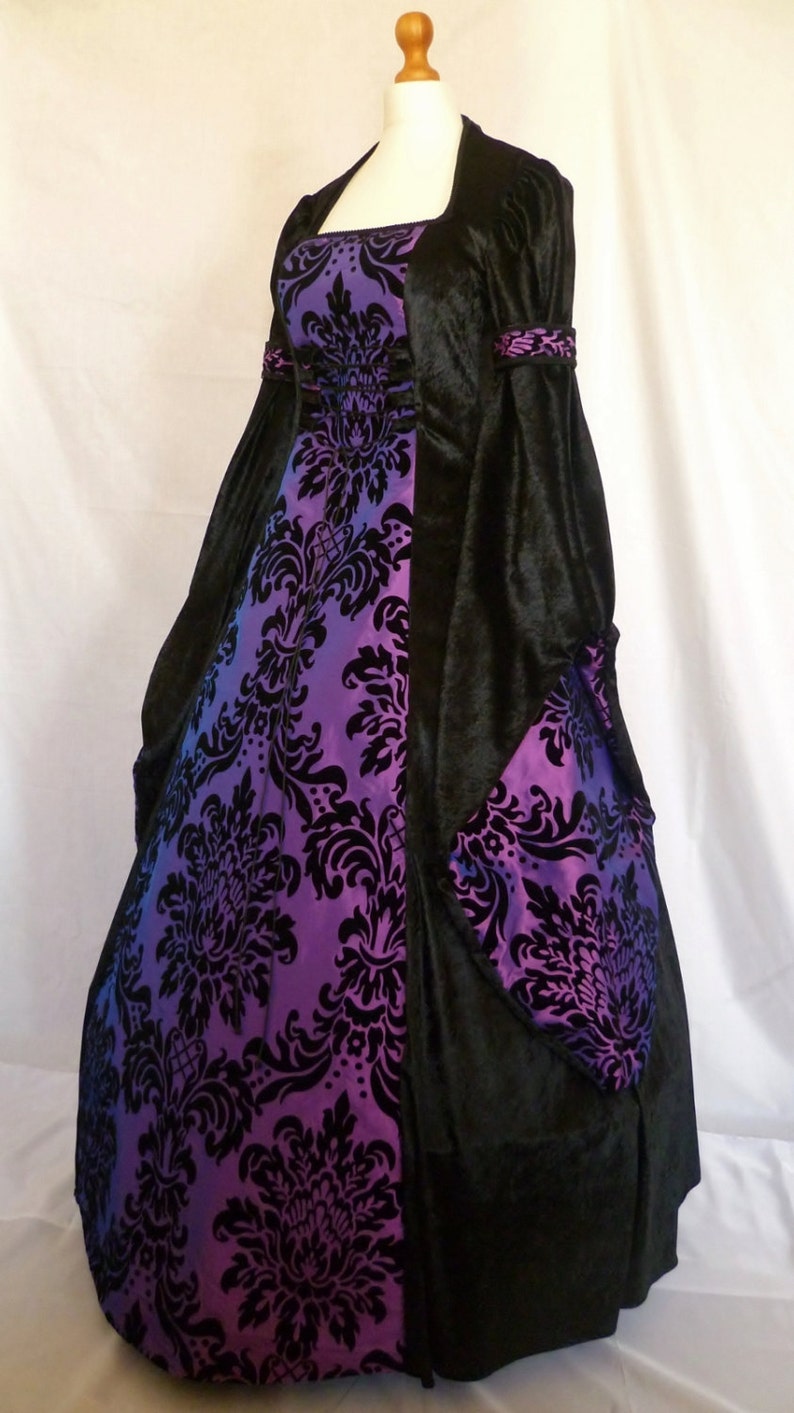 It will be made with beautiful jet black crushed velvet and purple and black flock taffeta. It will have a corset style front and back lacing so you can adjusted the dress to fit your body shape.