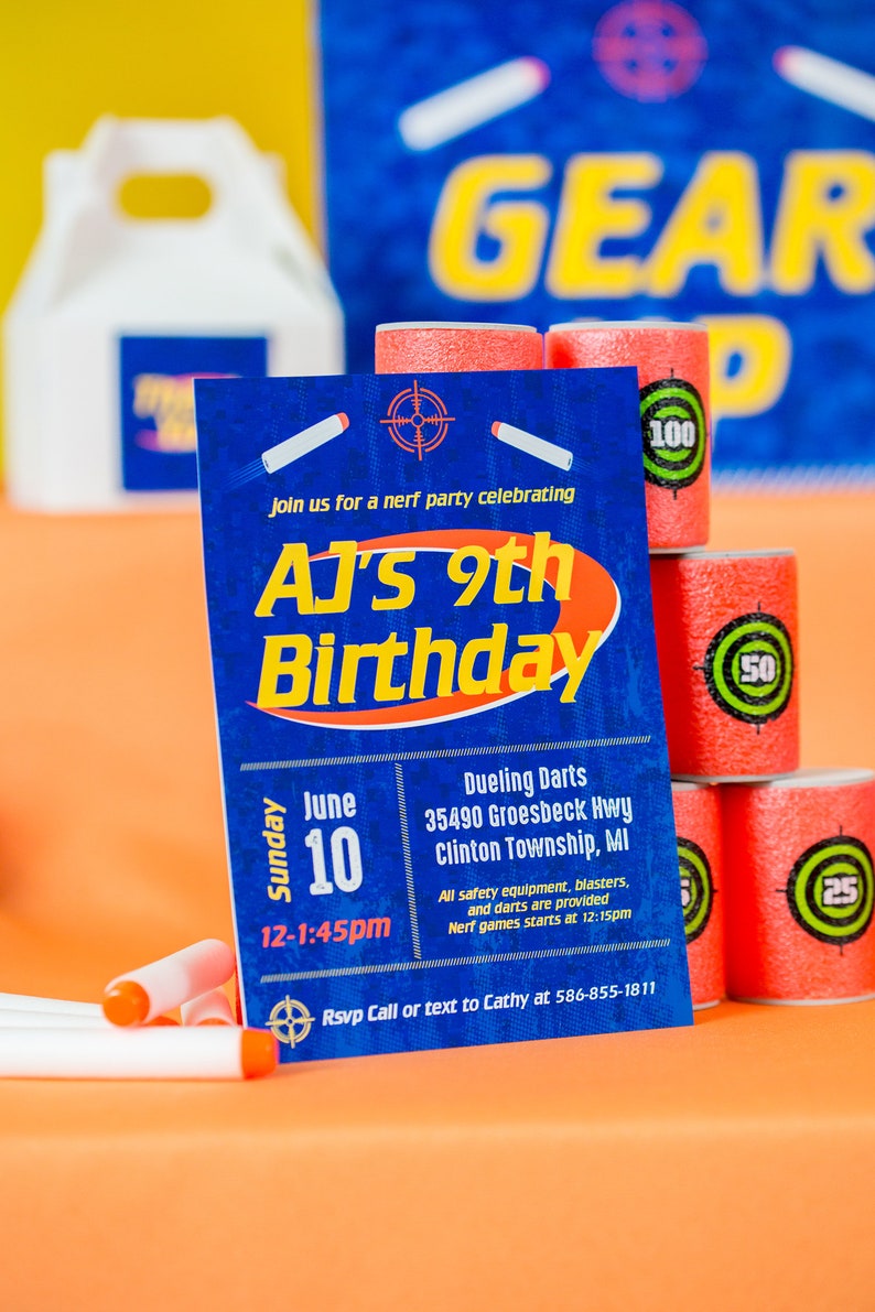 May include: A blue and orange birthday party invitation for AJ's 9th birthday. The invitation includes the date, time, and location of the party, which is a Nerf party with dueling darts. The invitation also includes a phone number to RSVP.