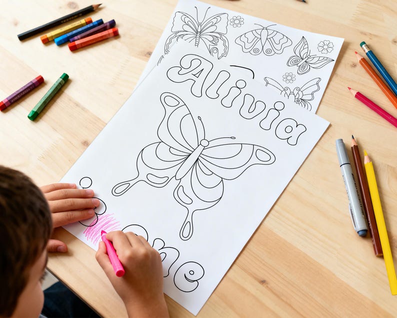 May include: A white colouring page featuring the name Alivia in bubble letters, surrounded by butterfly and flower line art illustrations. The page is being coloured with a pink crayon, with various coloured pencils scattered around the paper.