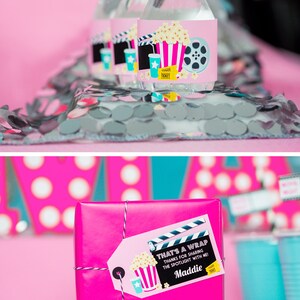 May include: Pink gift box with a movie themed gift tag that says "That's a Wrap! Thanks for sharing the spotlight with me! Maddie".