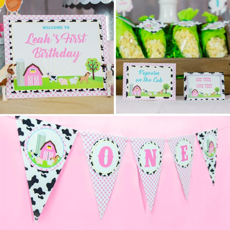 May include: A pink and white farm-themed birthday party banner with the word "ONE" in pink letters on each flag. The flags are decorated with black and white cow print and pink and white gingham.
