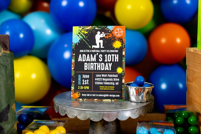 May include: A green, black, and orange birthday party invitation with a silhouette of a person holding a paintball gun. The invitation says "Join us for a paintball party celebrating Adam's 10th Birthday" and includes the date, time, and location of the party.