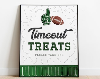 May include: A white sign with green and black football-themed graphics. The sign says "Timeout Treats" and "Please Take One".