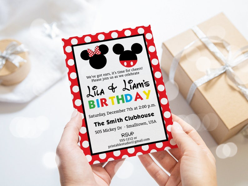 May include: A birthday invitation featuring Mickey and Minnie Mouse silhouettes. The invitation has a red polka dot border and includes the text "Lila & Liam's Birthday" in colorful letters. The invitation also includes event details.