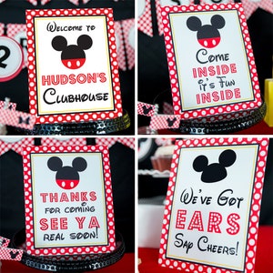 May include: Four decorative signs with a Mickey Mouse theme. Each sign has a white background with a red polka dot border and a black Mickey Mouse head silhouette. The signs have text that reads "Welcome to Hudson's Clubhouse", "Come Inside It's Fun Inside", "Thanks for Coming See Ya Real Soon!", and "We've Got Ears Say Cheers!"