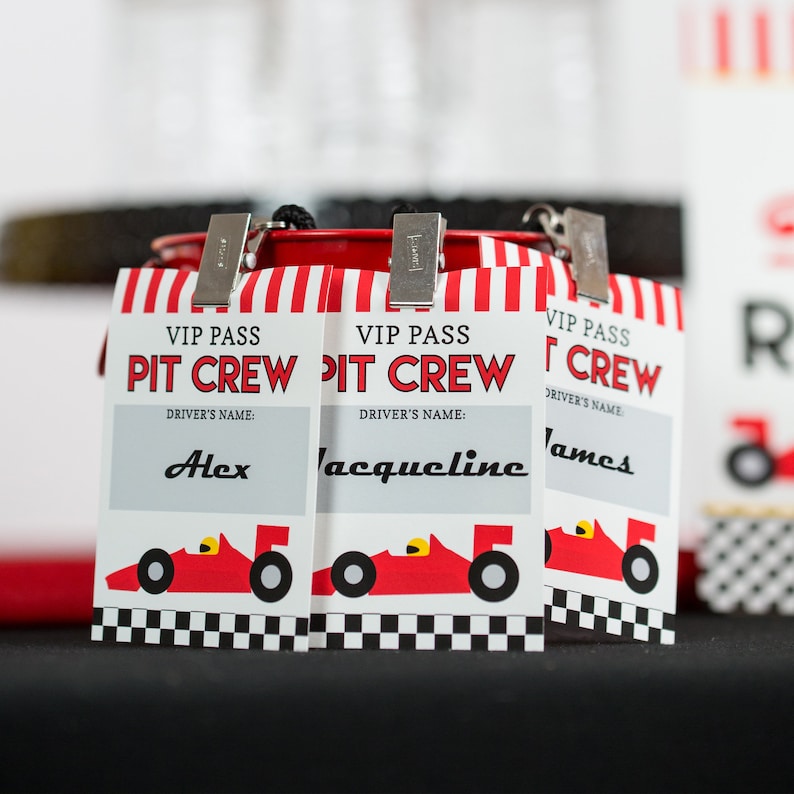 May include: Three red and white striped VIP pass cards with the text "VIP Pass Pit Crew" and a space for a driver's name. The names are "Alex", "Jacqueline", and "James". Each card has a red race car graphic.