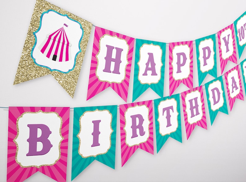 May include: Pink and teal banner with gold glitter accents. The banner says "Happy Birthday" with a tent graphic on the first flag.