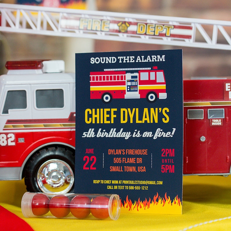 May include: A blue and yellow birthday invitation with a red fire truck illustration. The invitation reads "Sound the Alarm" and "Chief Dylan's 5th birthday is on fire!" with details for the party including the date, time, and location.