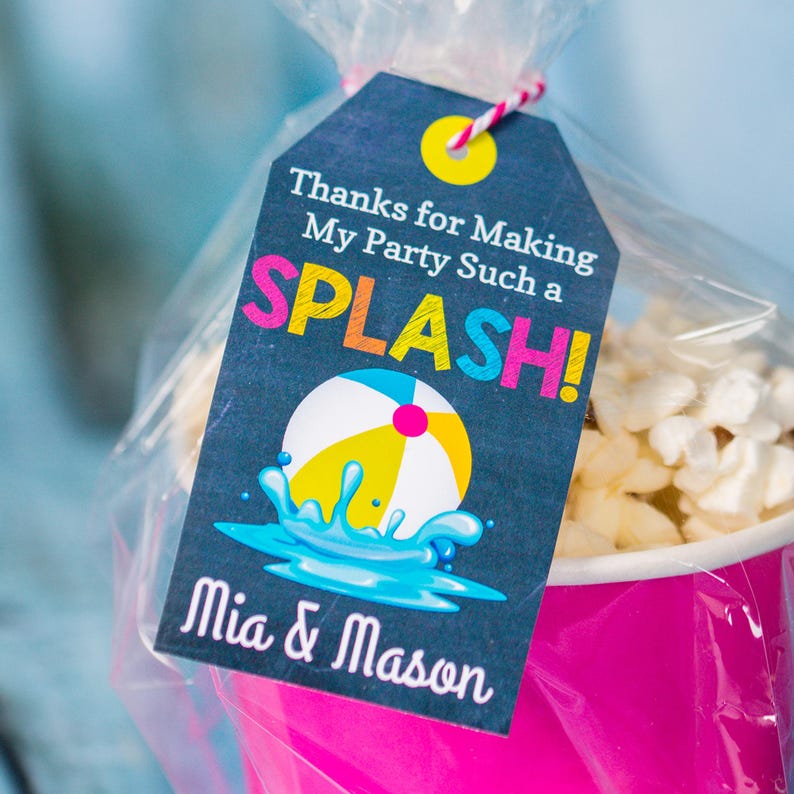 May include: A black and white favour tag with a colourful beach ball and the text "Thanks for Making My Party Such a SPLASH! Mia & Mason".