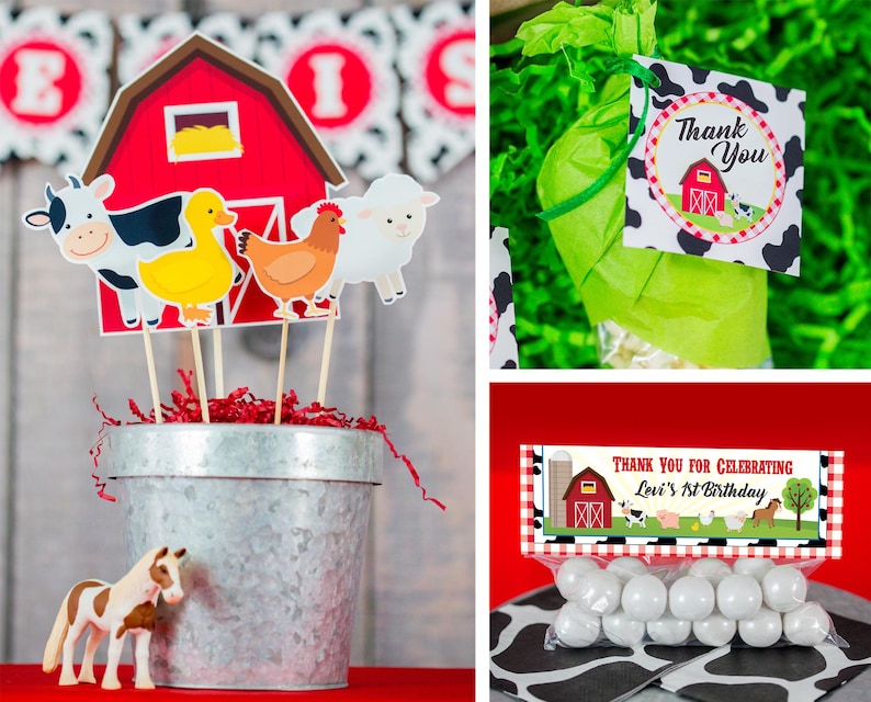 May include: A red barn with a white window and a yellow hay bale inside. There are farm animal cutouts on sticks in front of the barn, including a cow, a duck, a chicken, and a sheep. The cutouts are in a silver metal bucket with red and white shredded paper inside. There is a brown and white toy horse in front of the bucket.