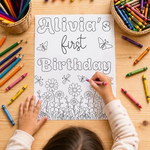 May include: A colouring page with the text Alivia's first Birthday in bubble and script lettering, surrounded by line art of flowers, butterflies, and dragonflies. The page is surrounded by coloured pencils and crayons in woven baskets.