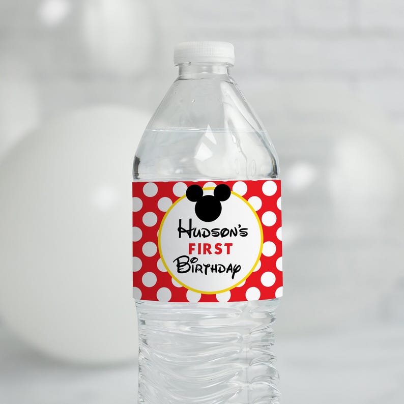May include: Water bottle label with red and white polka dots, a yellow circle with the text "Hudson's First Birthday" and a black silhouette of Mickey Mouse's head.