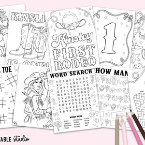 May include: A selection of black and white printable activity sheets with a cowboy theme. The sheets include a word search, tic-tac-toe, a maze, and colouring pages with the text "Kinsley FIRST RODEO". Pencils are visible.