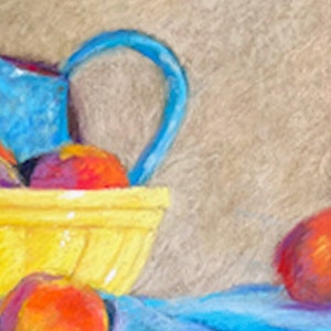 May include: A yellow ceramic bowl filled with peaches and plums, with a blue pitcher in the background. The bowl is sitting on a blue cloth.