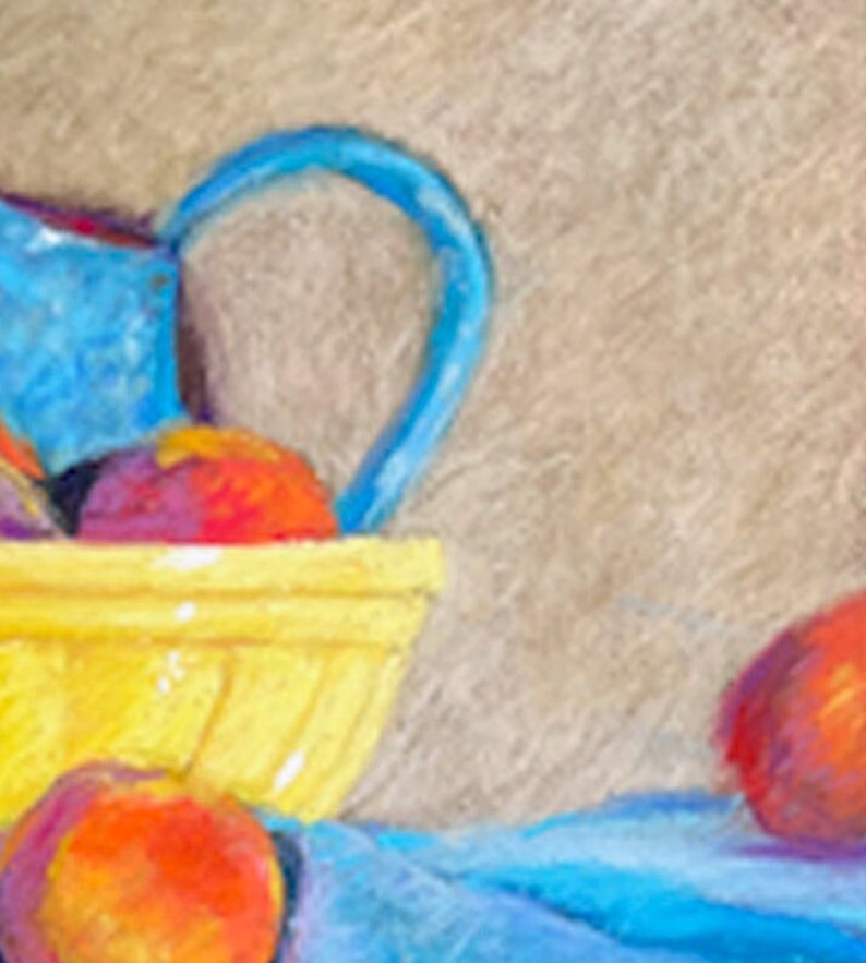 May include: A yellow ceramic bowl filled with peaches and plums, with a blue pitcher in the background. The bowl is sitting on a blue cloth.