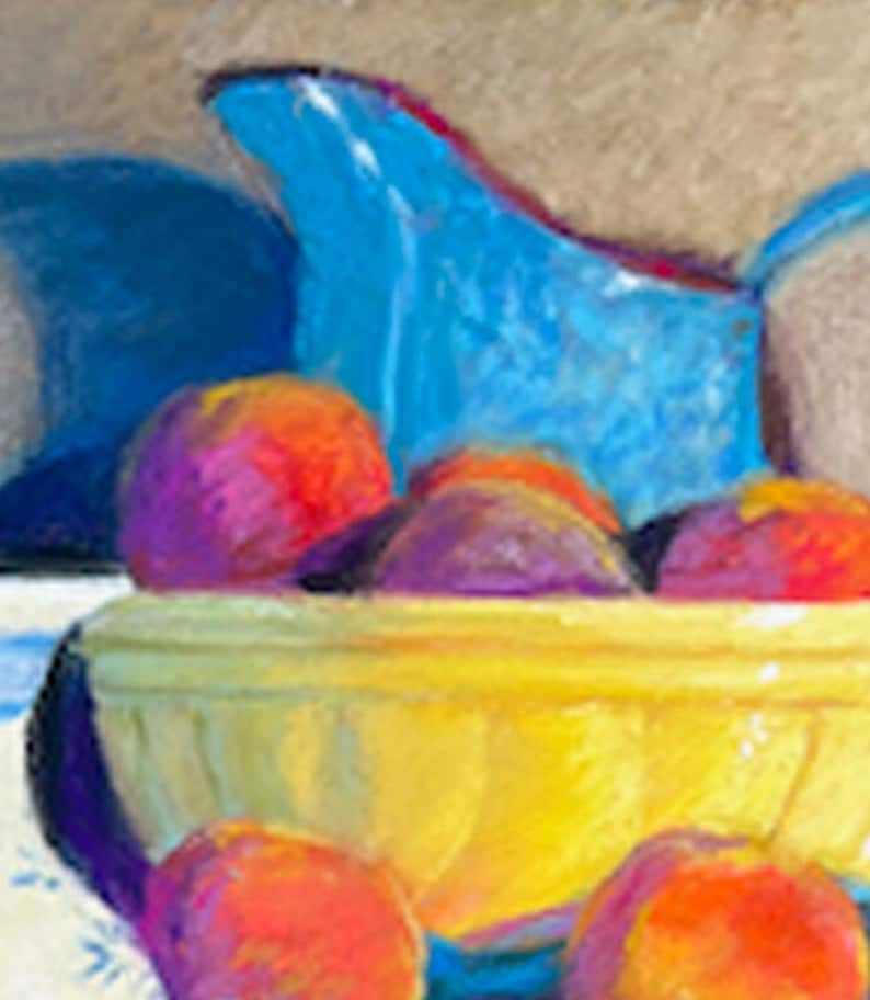 May include: A yellow ceramic bowl filled with red and purple peaches. A blue pitcher sits on top of the peaches.