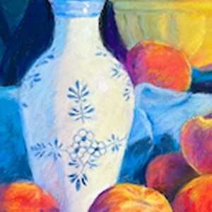 May include: A white porcelain vase with blue floral designs sits on a blue cloth with a bowl of peaches and other fruit in the background.