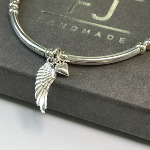 Sterling Silver Angel Wing Charm Bracelet: Beaded Stretch Jewelry