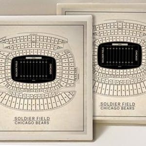 May include: Two square decorative tiles featuring a detailed schematic of Soldier Field, home of the Chicago Bears. The stadium layout is rendered in black and white, with the words "SOLDIER FIELD CHICAGO BEARS" at the bottom.
