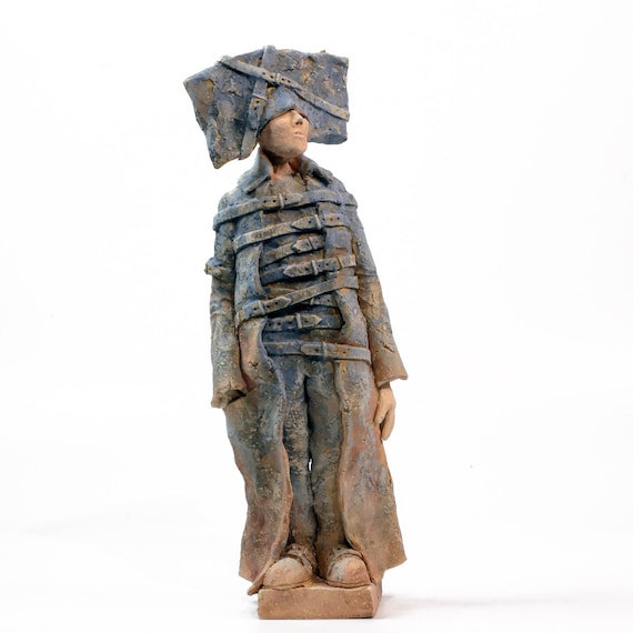A hauntingly expressive original ceramic figure by named artist Arek Szwed — the kind of sculptural storytelling you'd find in a gallery, not a gift shop.