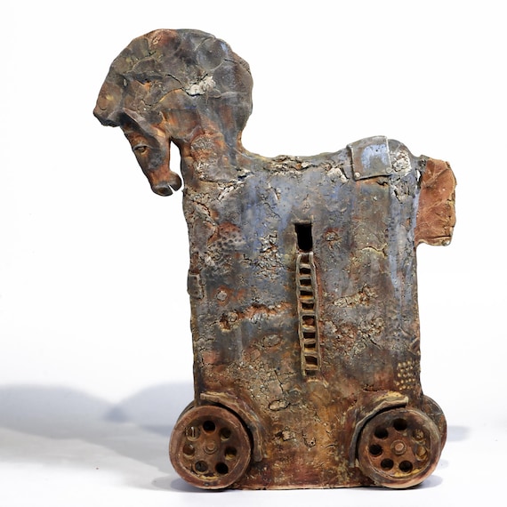 A handmade ceramic Trojan Horse sculpture — ancient myth rendered in clay by an actual human, not a factory.
