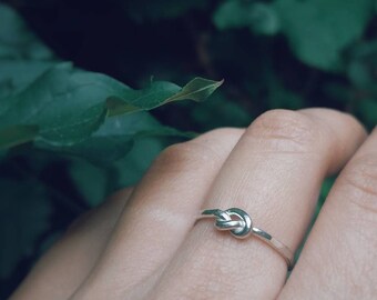 Thin Knot hammered ring in sterling silver.