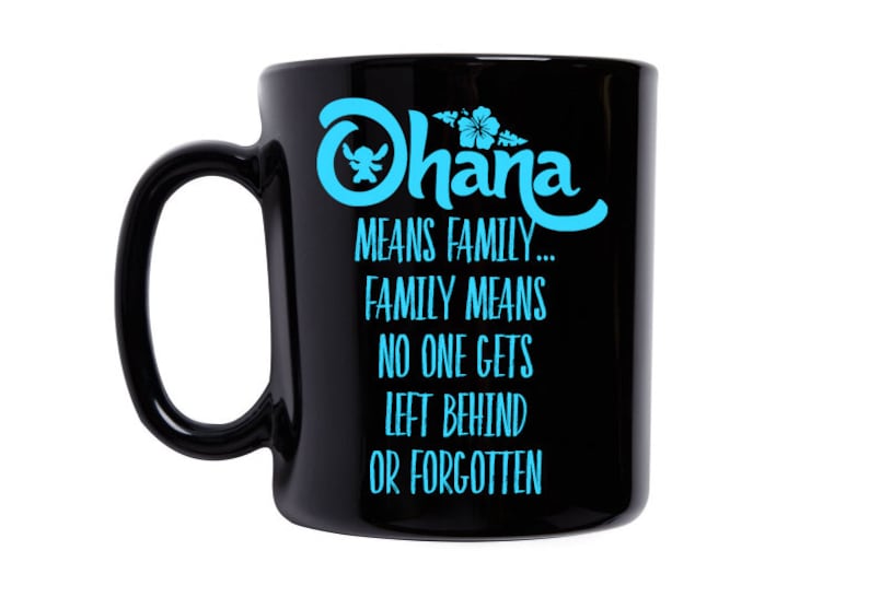 May include: Black ceramic coffee mug with a blue and white graphic that says "Ohana means family... family means no one gets left behind or forgotten".