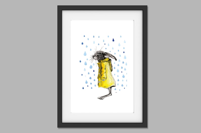 May include: A black and white illustration of a rabbit wearing a yellow raincoat standing in the rain. Blue raindrops are falling around the rabbit.