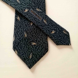 Necktie by Lanvin Paris. Motif with gold wings on a blue background. Grafic motif bee fly. Rare Lanvin tie.Skinny Lanvin tie. Lanvin men.