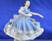 Miniature lace figurine vintage collectable of a ballerina dancer manufactured by the Dresden porcelain factory in the early 1950s