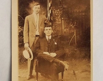Vintage RPPC: Two Men in Suits, American Flag Backdrop, AZO Postcard