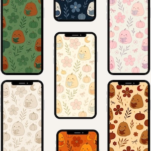 May include: A collection of phone screens displaying fall-themed wallpapers. Each wallpaper features a repeating pattern of pumpkins, flowers, and leaves in various colors, including orange, green, pink, and beige. The pumpkins are depicted reading books.